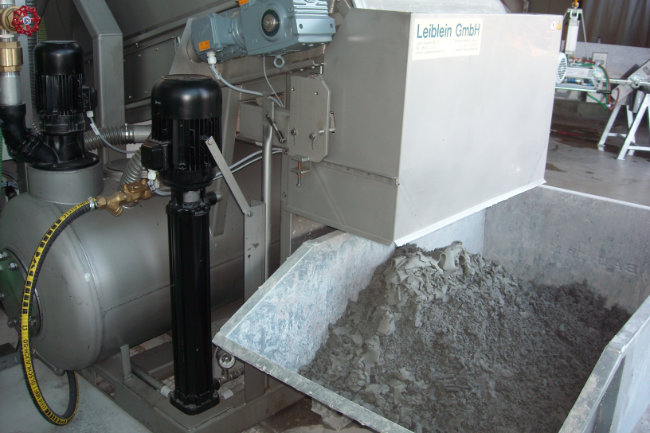 Replacement of a chamber filter press with a vacuum belt filter for dewatering natural stone circulation water